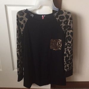 Boutique shirt with sequin pocket.